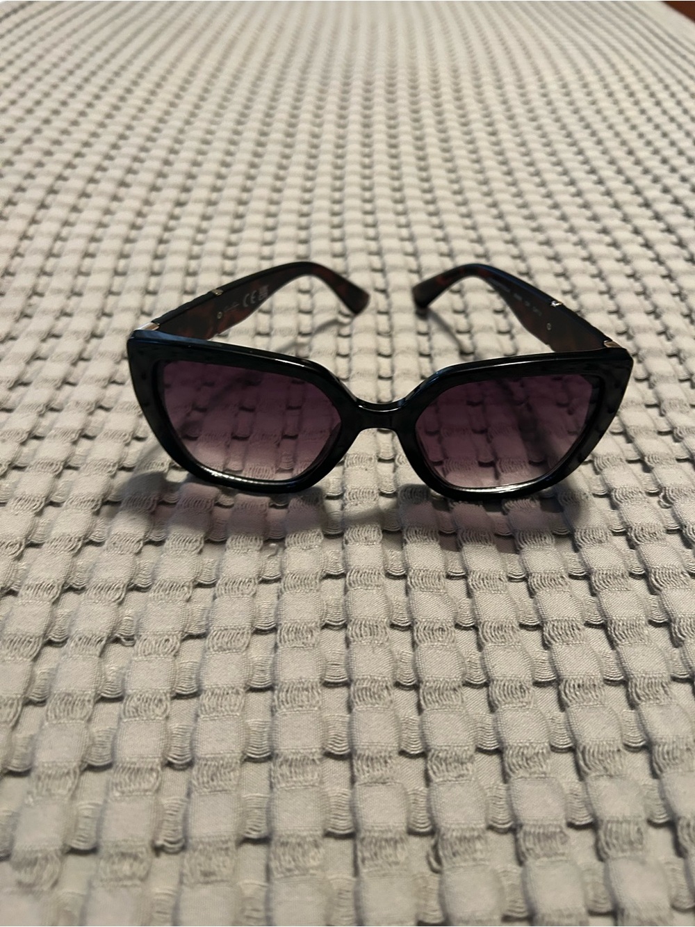 Jessica Simpson Black Cat-Eye Women's Sunglasses with Purple Lenses